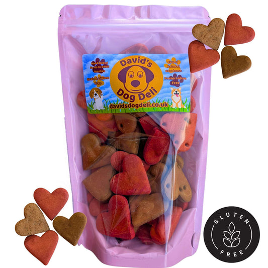 valentines dog treats bag with biscuit hearts outside the bag